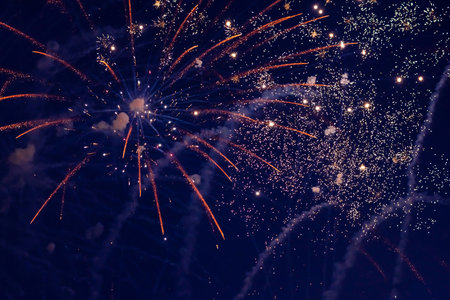 Inexpensive, budget, beautiful fireworks in the city, against the backdrop of the night sky. high...