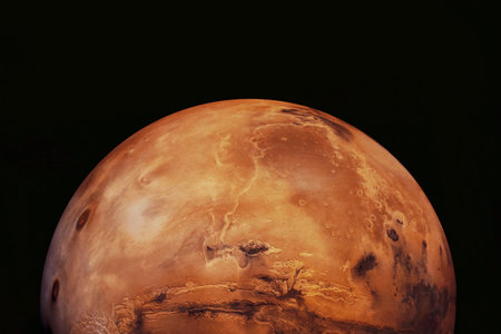 Mars, the red planet, shines against the dark void of space. Elements of this image furnished by NASA
