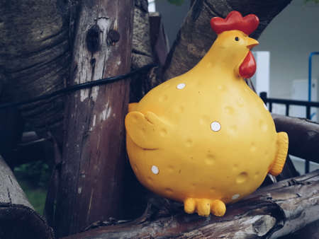 Ornament chicken on treeの写真素材