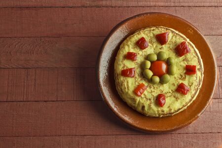 Spanish omelette on antique plate and wooden backgroundの写真素材