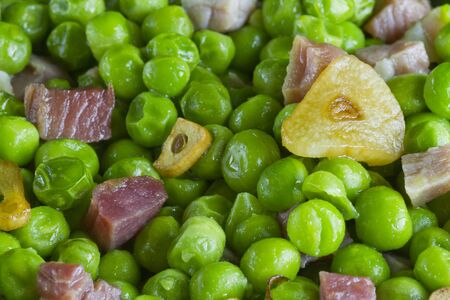 Peas with ham and garlic backgroundの写真素材