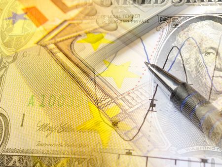 A pen and calculator with banknote - abstract business background.の写真素材
