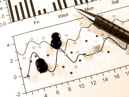 Pen and drawing-pins against the chart, in sepia.