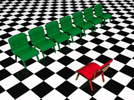 Green and red chairs on chequered background.の写真素材
