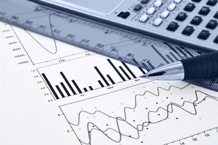 Business background with graph, ruler, pen and calculator, in blues.の写真素材