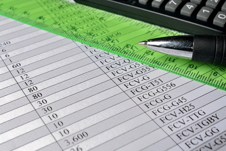 Business background with graph, ruler, pen and calculator.の写真素材