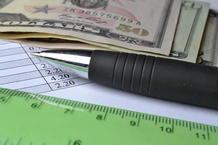 Business background with table, money and pen 