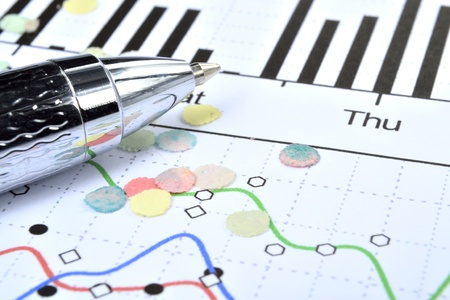 Business background with graph,notebook and confetti.
