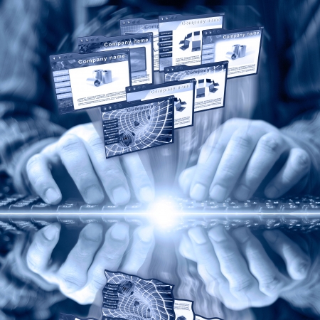 Hands on the keyboard and web pages - abstract computer background in blues.