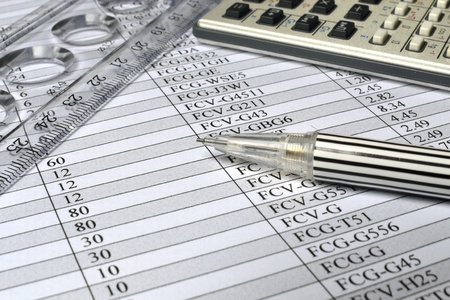 Business background with table, ruler, pencil and calculator.の写真素材