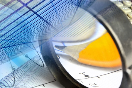 Magnifier with pencil on business background 
