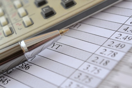 Business background with graph, ruler, pen and calculator.の写真素材