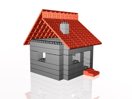 Toy home on white reflective background.の写真素材