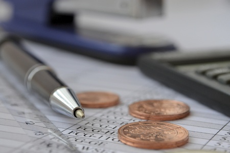 Business background with table, euro coins and pen の写真素材