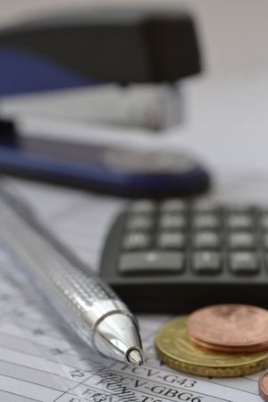 Business background with money, calculator and pen (portrait orientation).の写真素材