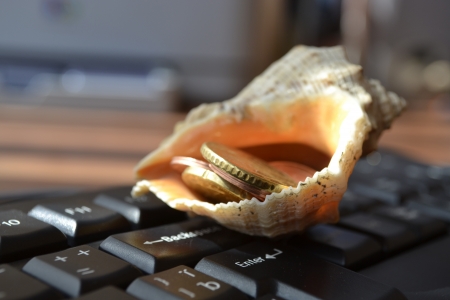Keyboard with shell - abstract office background.の写真素材