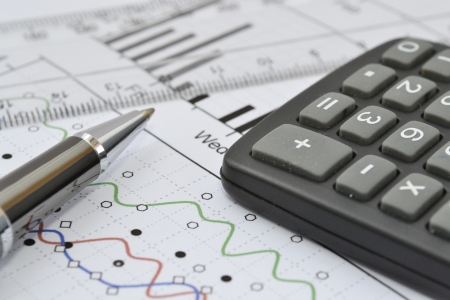 Business background with graph, ruler, pen and calculator.の写真素材
