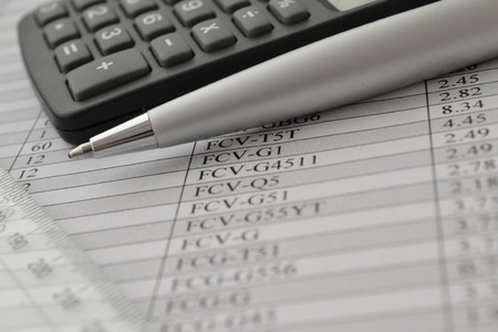 Business background with graph, ruler, pen and calculator.の写真素材