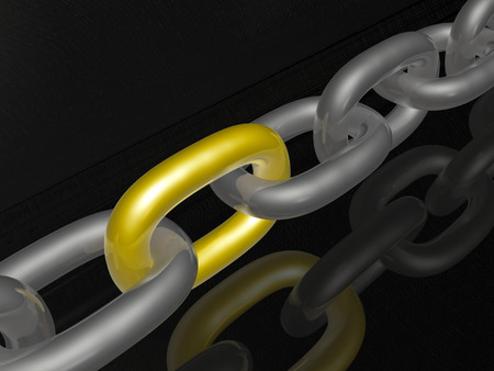 Grey chain with yellow link, black background.の写真素材