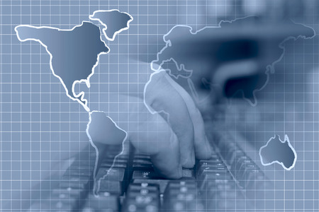 Business in blues with hands, keyboard and map.