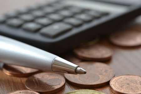 Financial background with money, calculator, table and pen.の写真素材