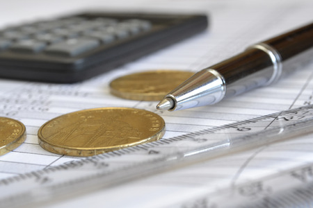 Financial background with money, calculator, table and pen.の写真素材