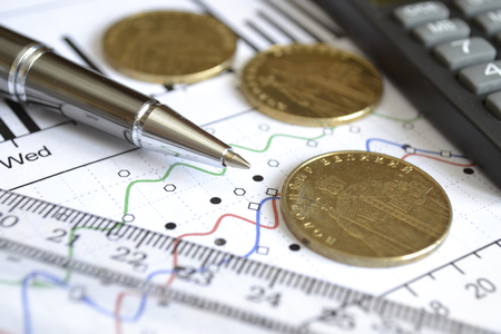 Financial background with money, calculator, graph and pen.の写真素材