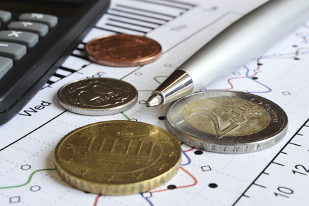 Financial background with money, calculator, graph and pen.の写真素材