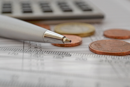 Financial background with money, calculator, table, ruler and pen.の写真素材