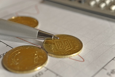 Financial background with money, calculator, graph and pen.の写真素材