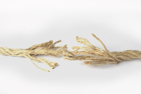 Almost broken rope on the white background.の写真素材