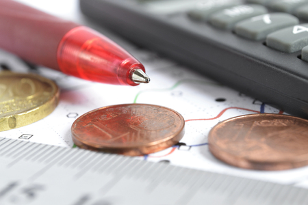Financial background with money, calculator, ruler, graph and pen.の写真素材