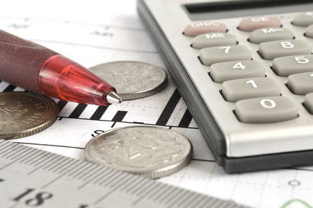 Financial background with money, calculator, graph and pen.の写真素材