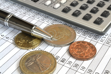 Financial background with money, calculator, ruler, table and pen.の写真素材