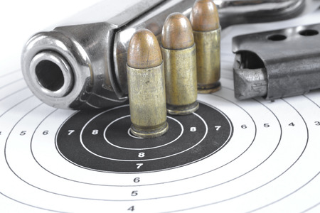 Pistol and ammunition on the white background.