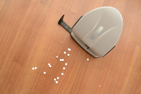 Business background with table and puncher.の写真素材