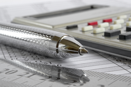 Business background with table, pen and calculator.の写真素材