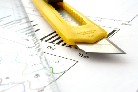 Business background with graph, ruler and cutter.の写真素材
