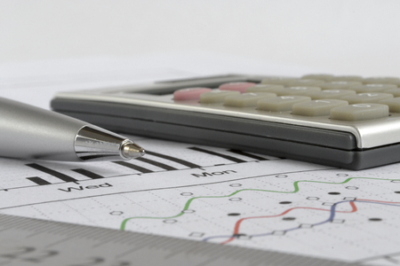 Business background graph, ruler and calculator.
