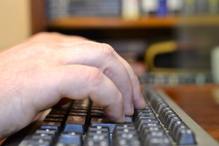 Abstract background with hands on the keyboar.