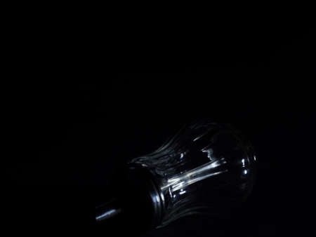 Empty sugar dispenser in dark room. Low key studio shot. Dark mood picture.の写真素材