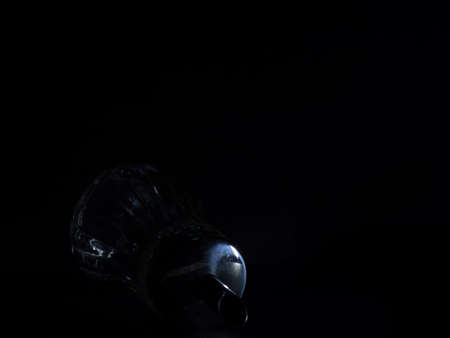 Empty sugar dispenser in dark room. Low key studio shot. Dark mood picture.の写真素材