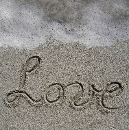 love-The words 'Love' written in the inviting sands of a Southern italyの写真素材