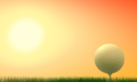 Golf ball with tee in the grass at sunsetの写真素材