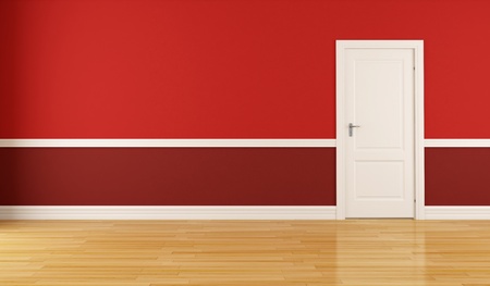 Empty red room with closed white doorの写真素材