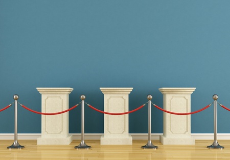 Blue museum with  empty pedestal and barrier rope
