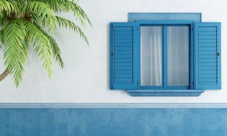 Detail of a Mediterranean house with blue wooden window and palm tree - rendering の写真素材