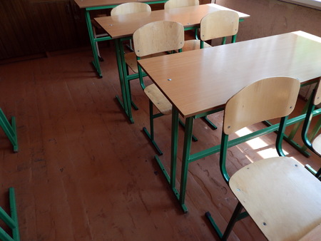 School desks in the classroom and chairsの写真素材