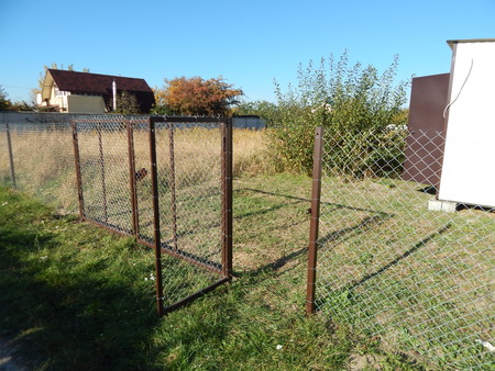 Construction of a fence from a chain-link grid on the land plotのeditorial素材