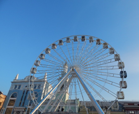 Ferris wheel spinning on the square for recreationの写真素材